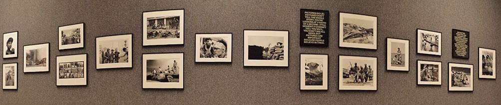 grey art gallery wall full of black and white photos