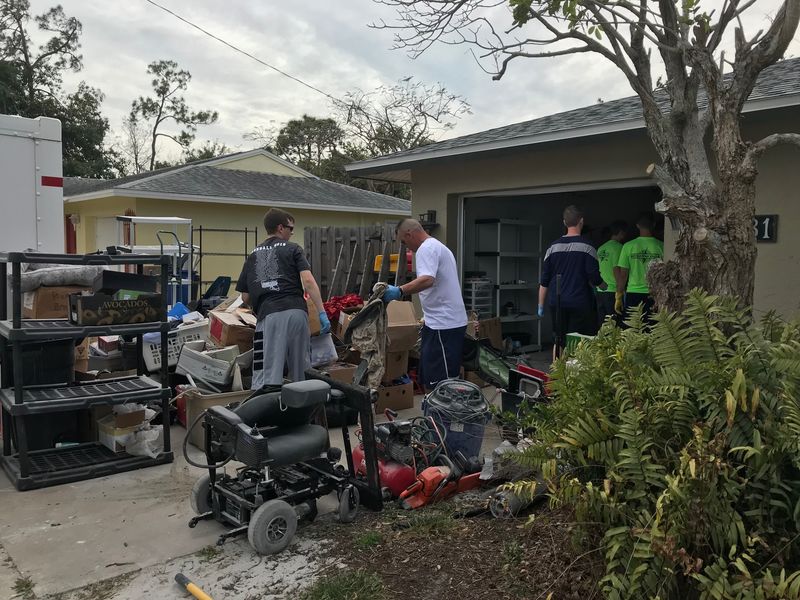 Shane Molyneaux and Jim Perry help clear out Florida home damaged by Hurricane Irma