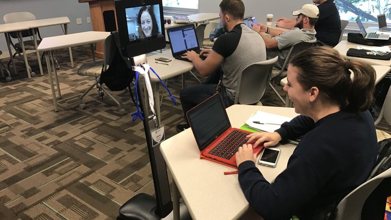 Students in class interact with robot Students in class interact with robot