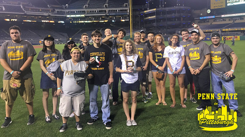 Students play catch on the field at PNC Park