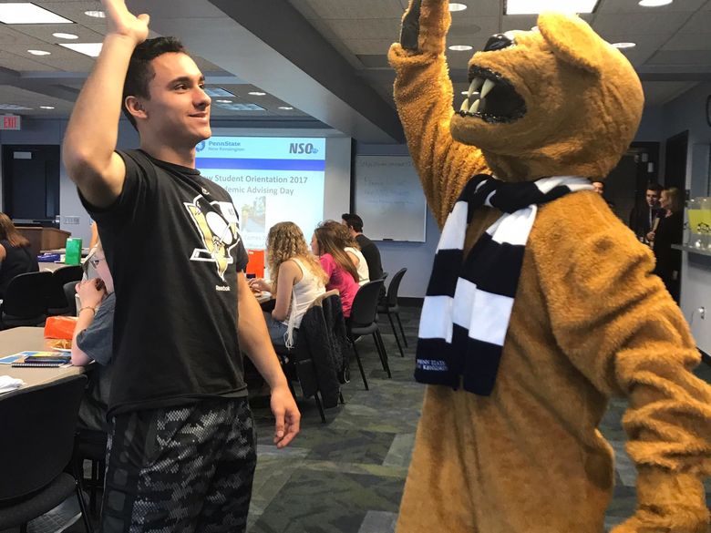 Student with Nittany Lion mascot at Orientation