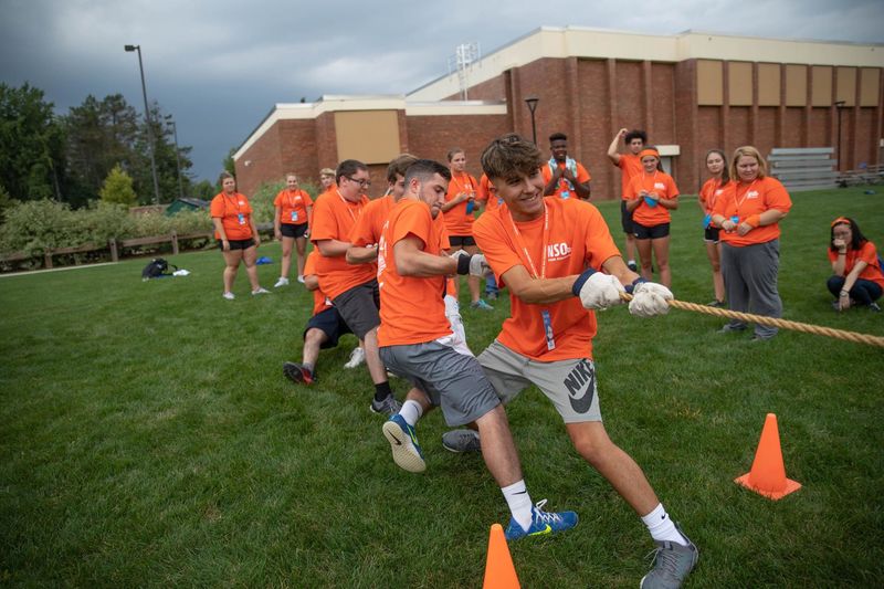 Students pulling rope during tug of war game