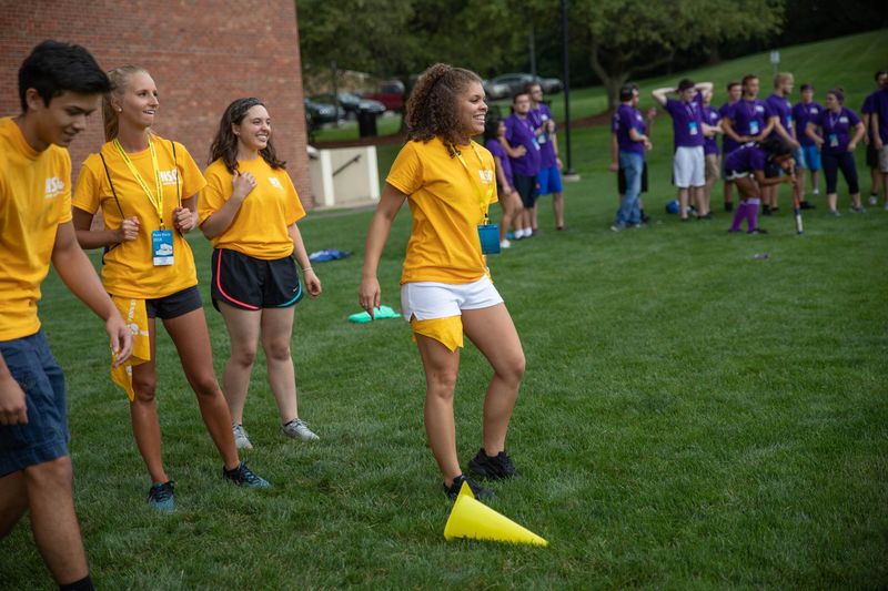 Orientation leader cheers on students