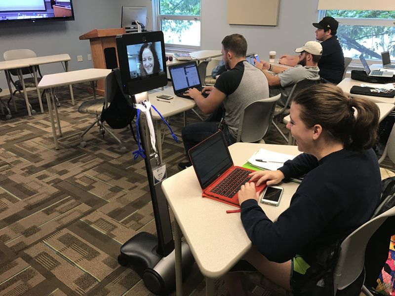 Students in class interact with robot Students in class interact with robot