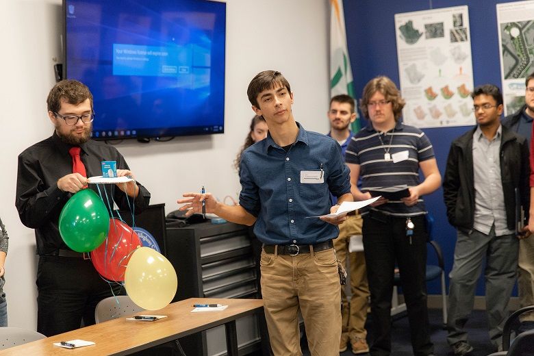 Male student speaks to group