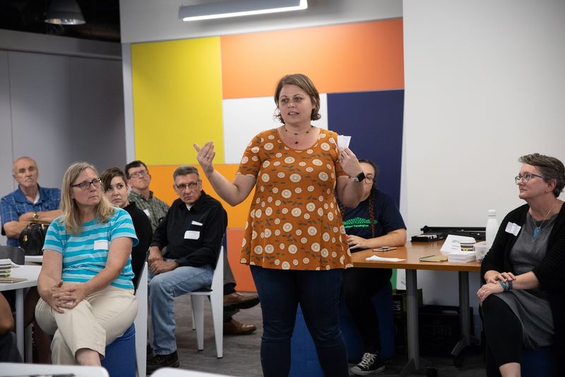 Woman speaks to group at reNew Kensington Community Workshop