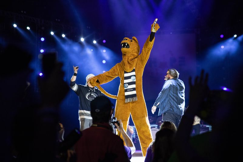 Nittany Lion mascot stands on stage