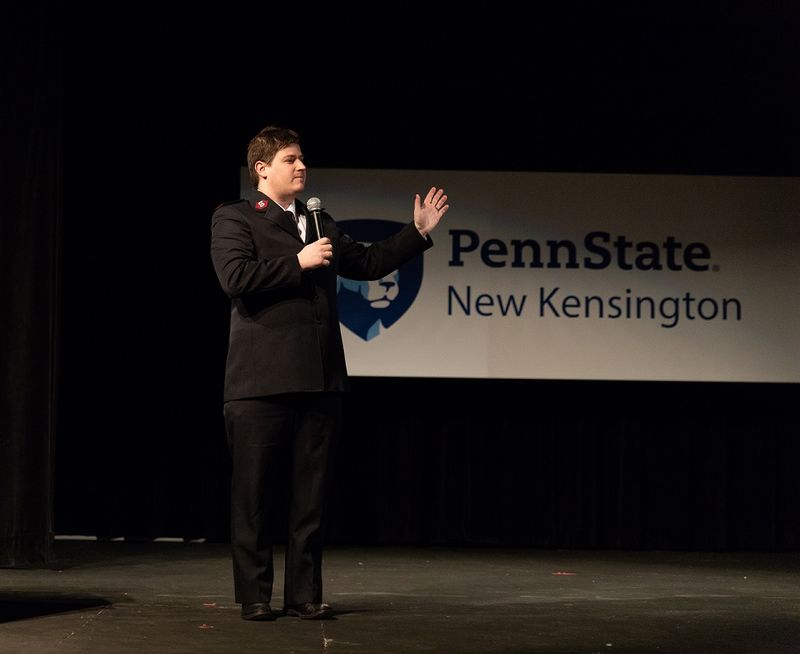 Man speaks on stage Man speaks on stage