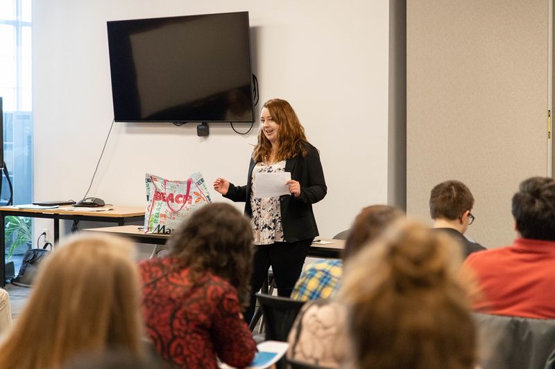 Woman speaks to group