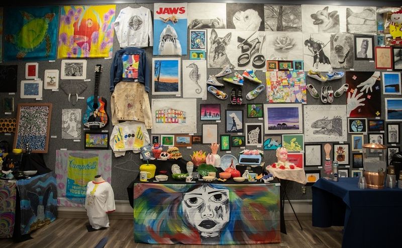 Artwork in variety of mediums hangs in gallery Artwork in variety of mediums hangs in gallery