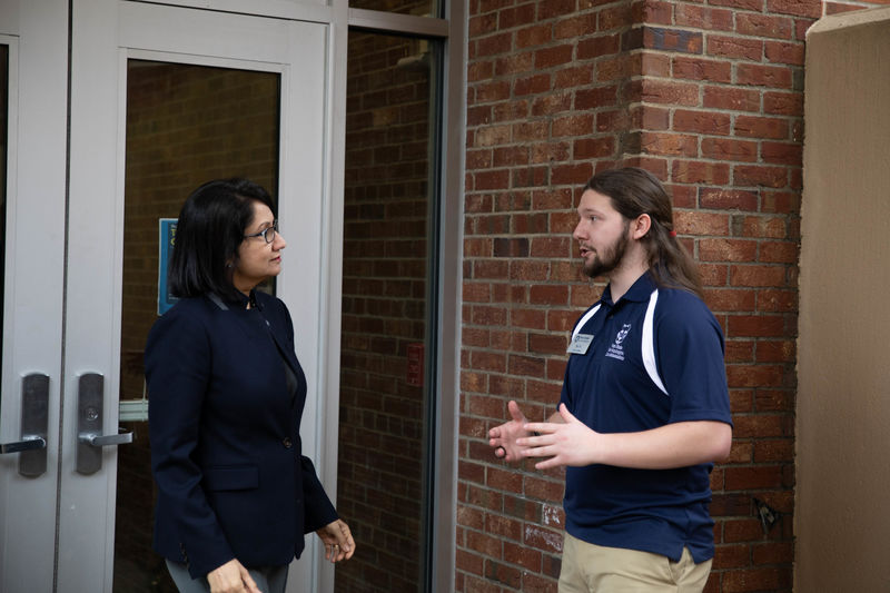 President-elect Neeli Bendapudi stands with student Nic Hill