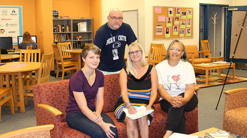 A few members of the Adult Learning Community meet in the Success Center