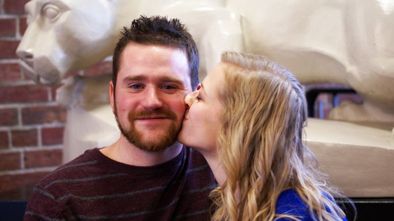Ashley Myerski kisses Greg Zyhowski on the cheek after proposal