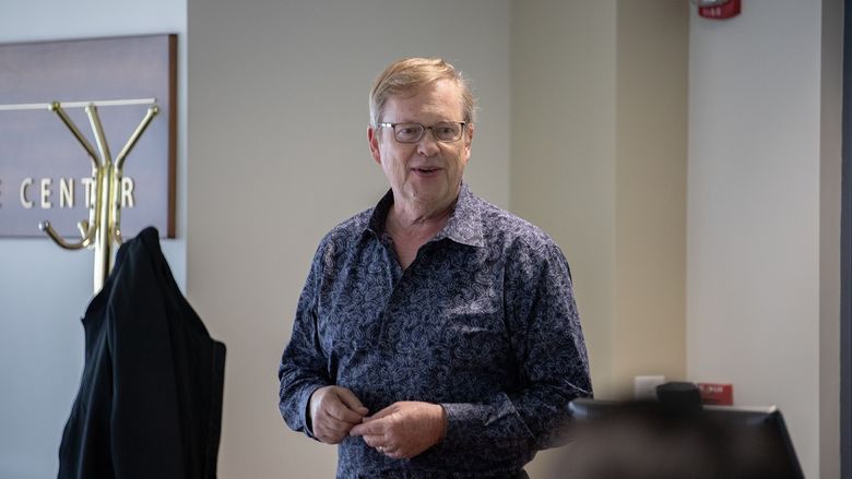 Man speaks to group