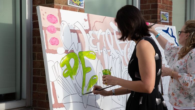 Guests paint mural at the 2018 Off the Wall pARTy