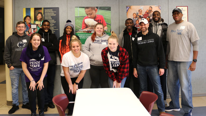 group of staff and students smiling 