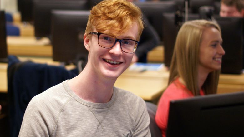 New Kensington student smiles at Help Desk for orientation