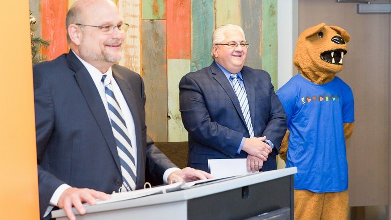 Dr. Kevin Snider, Chancellor, Penn State New Kensington (left), Thomas Guzzo, Mayor, City of New Kensington, and the Nittany Lion mascot