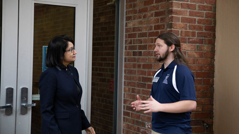 President-elect Neeli Bendapudi stands with student Nic Hill