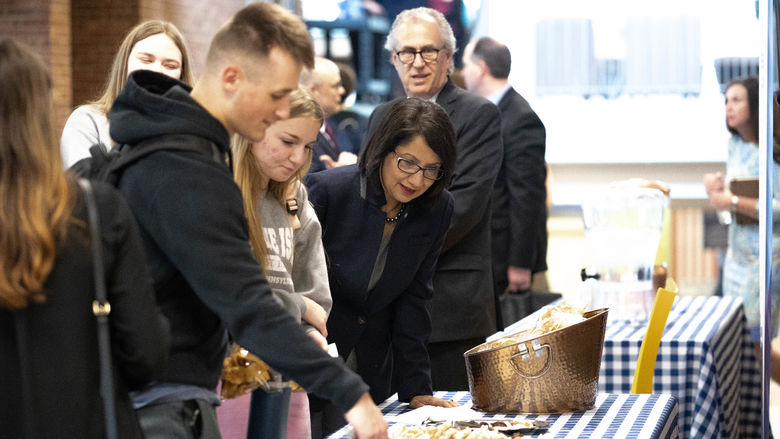 Group next to table with food