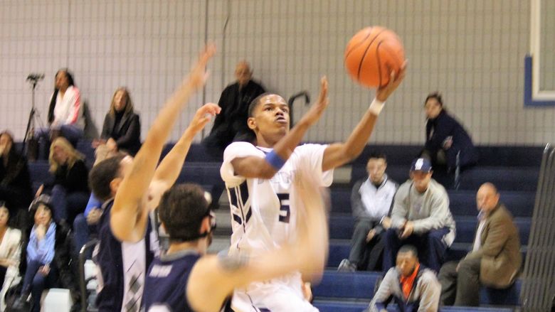 Dorian Broadwater goes for layup during basketball game