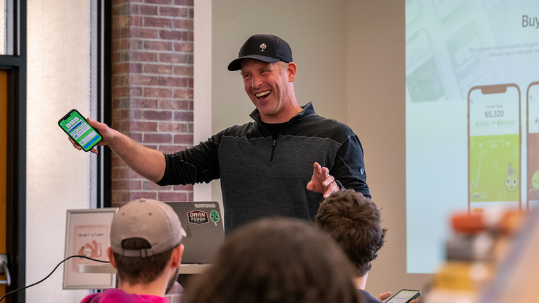 Gene Natali gives an animated presentation to students inside the Blissell Library.