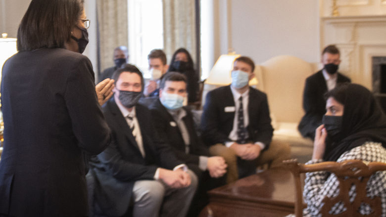 Neely Bendapudi, in the foreground, addresses a group of Penn State student leaders.