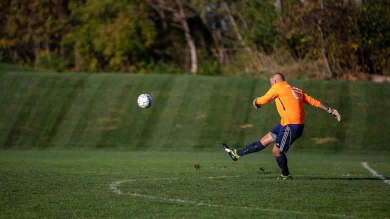 Man kicks soccer ball