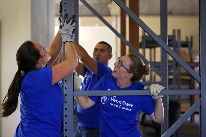 World Campus student volunteers work on building