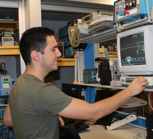 Student testing equipment in BET lab Student in lab