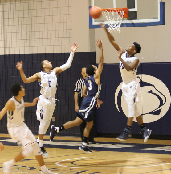 PSNK players going for rebound Men's basketball