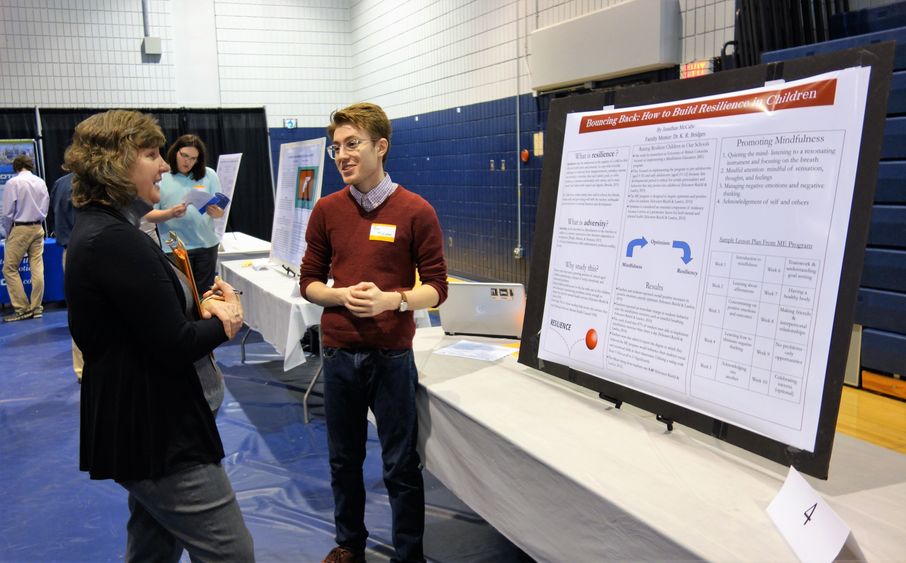 Jonathan McCabe, senior psychology student, presents his research poster at the 2018 Research and Creative Exposition