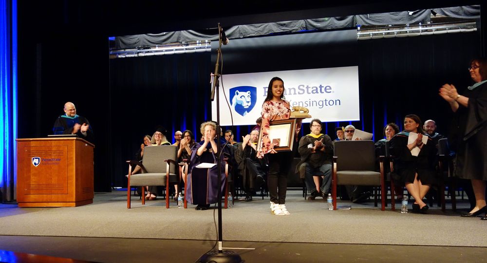 Paulina Iniguez stands on stage after receiving the 2018 Walker Award
