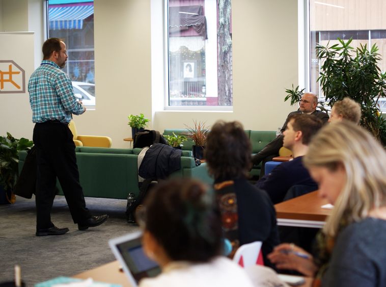 Faculty and staff listen to presentation