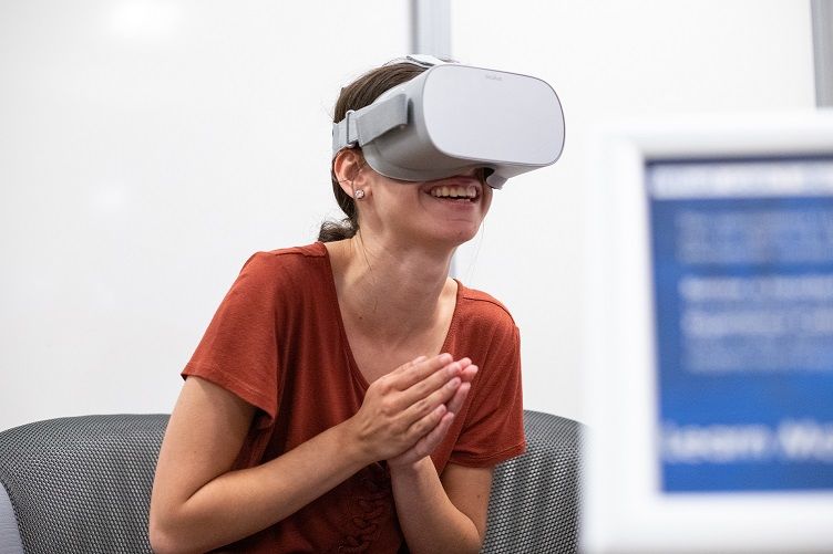 Female wearing virtual reality headset Female wearing virtual reality headset