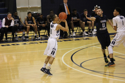 Basketball player shooting three-pointer Basketball player
