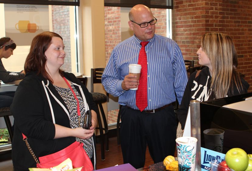 Chancellor and students at coffee bar Chancellor and students