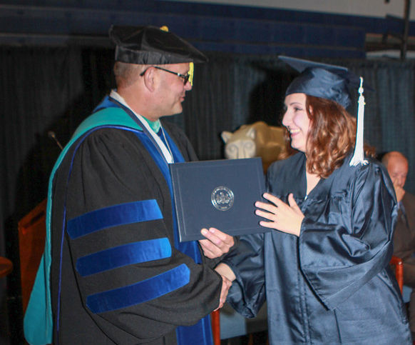 Student and chancellor at commencement Commencement Spring 2016
