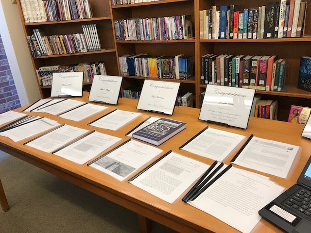 New Kensington faculty publications line a table in the library during annual celebration