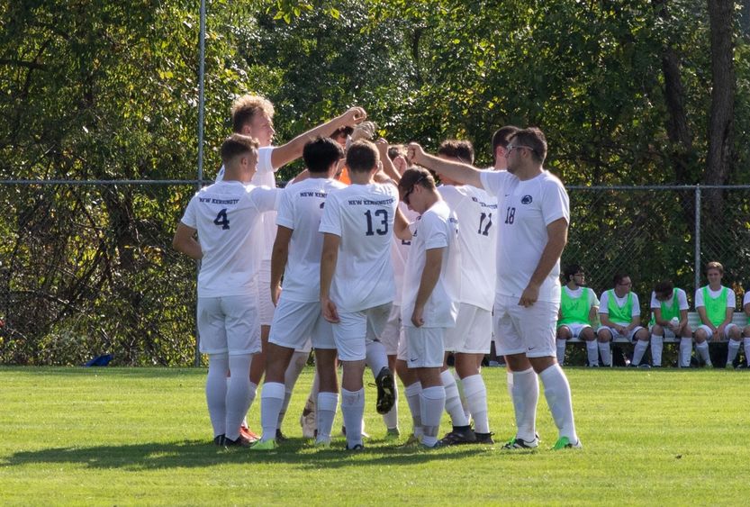 New Kensington soccer players in huddle