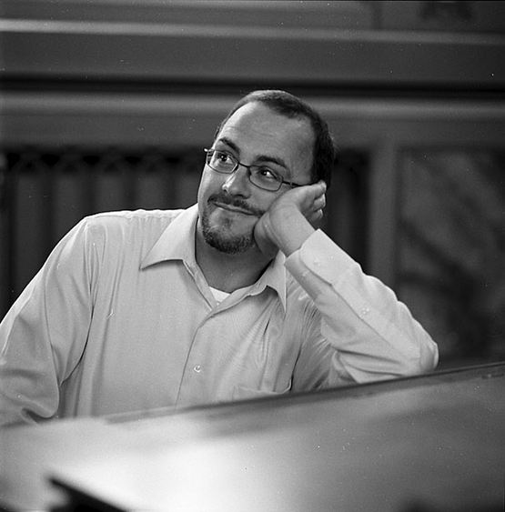 Tom Roberts sitting at piano Tom Roberts sitting at piano