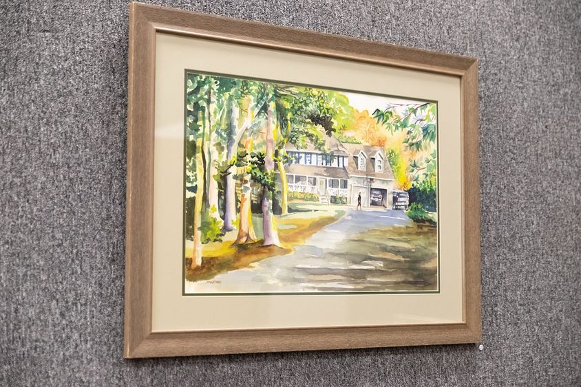 Painting hanging on wall Painting hanging on wall