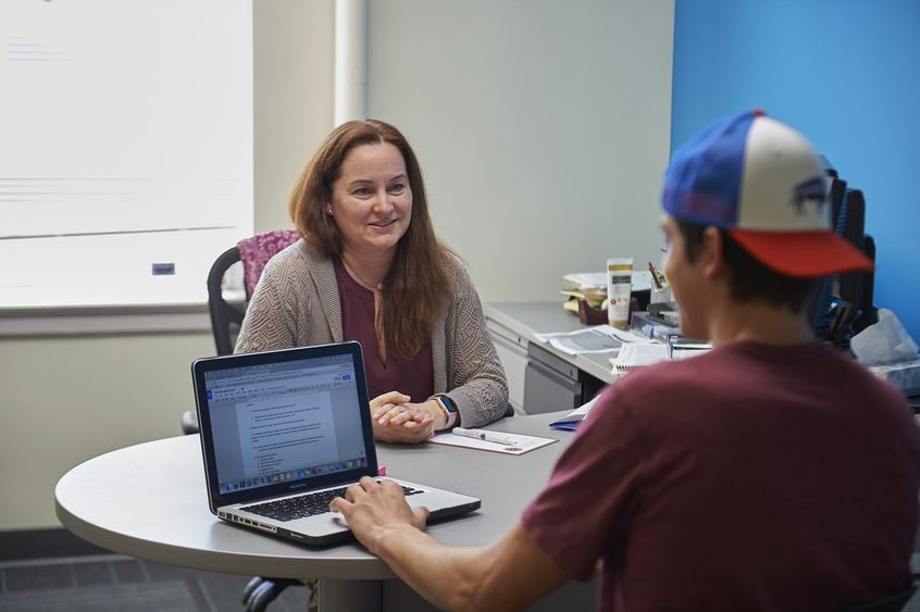 Academic adviser talking to student