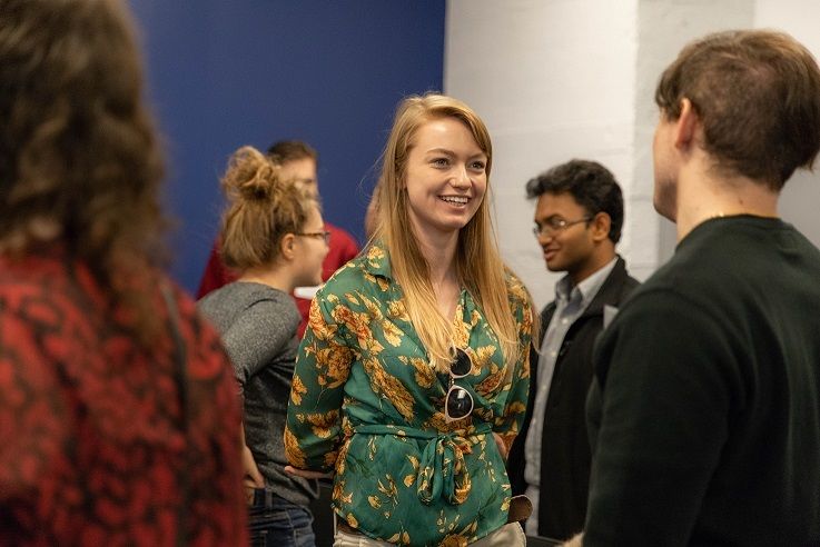 Female student speakers to another student Female student speaks to another student