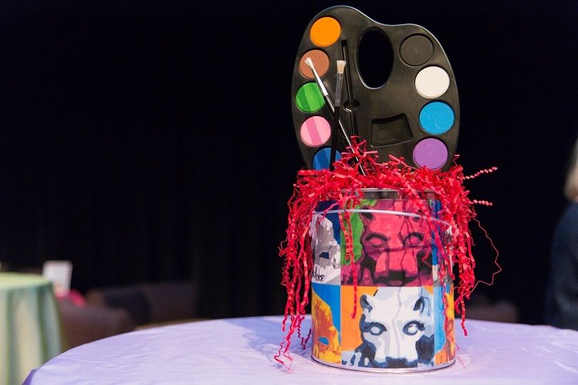 Paint can centerpiece on table at the 2018 Off the Wall pARTy
