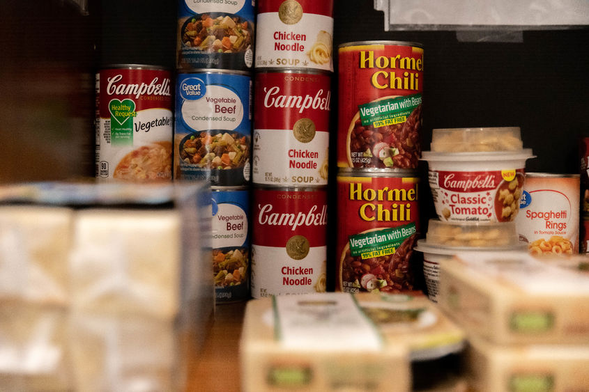 Canned goods and other products in cabinet